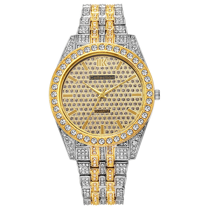 Luxury watch with gold and silver band and diamond-studded face on a white background