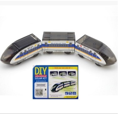 Solar train kit with three toy trains and a packaging box on a white background