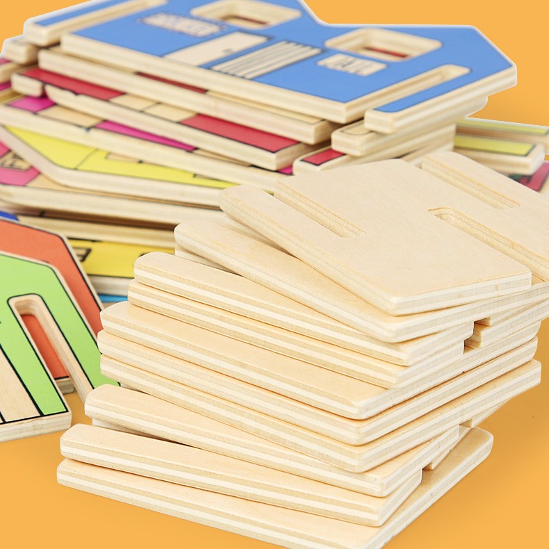 Stack of wooden puzzle pieces on a yellow background