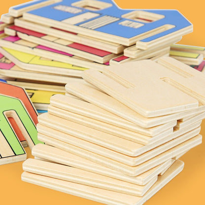 Stack of wooden puzzle pieces on a yellow background